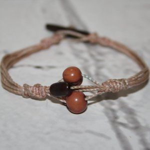 Beautiful pink cord and wooden bead bracelet 7"
